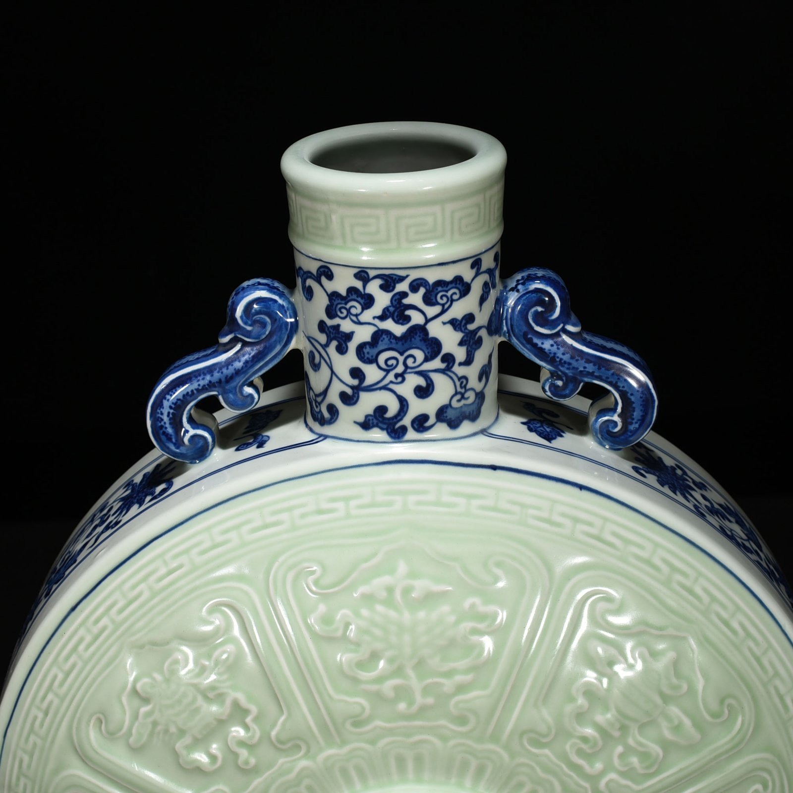 Qing Dynasty Qianlong blue and white bean green glaze carved Buddhist eight-treasure pattern moon vase