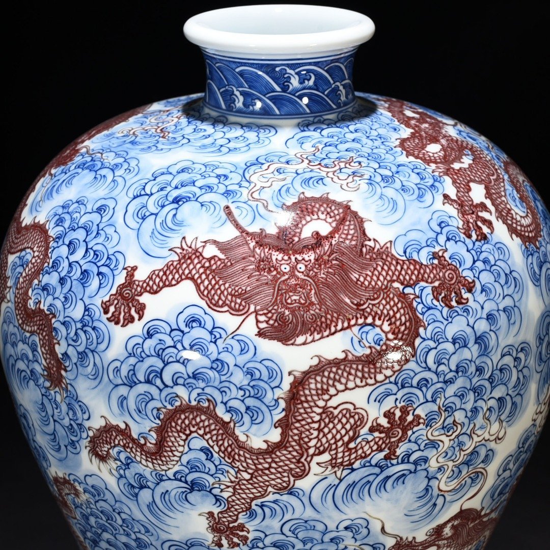 Qing Dynasty Qianlong blue and white underglaze red nine-dragon pattern plum vase
