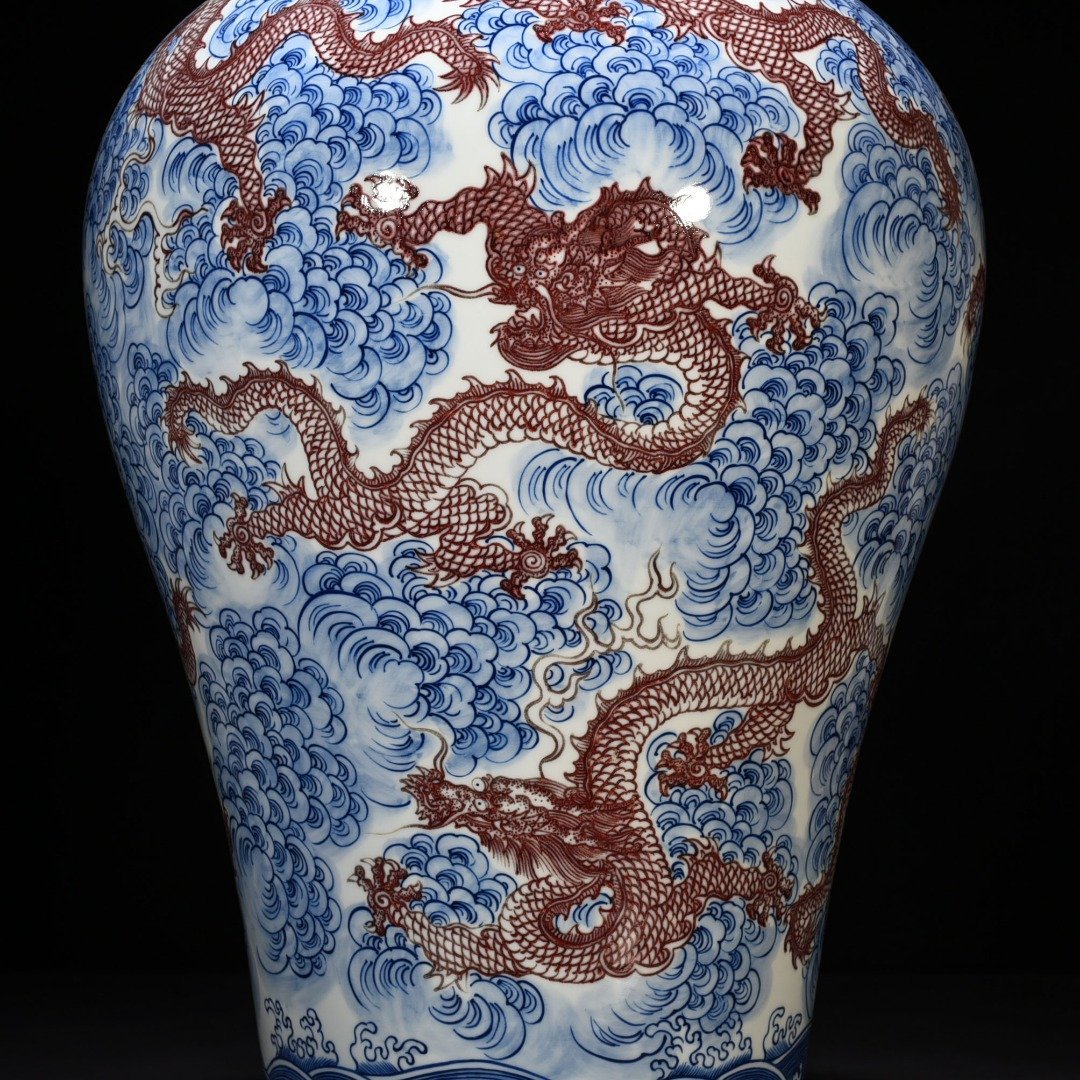 Qing Dynasty Qianlong blue and white underglaze red nine-dragon pattern plum vase