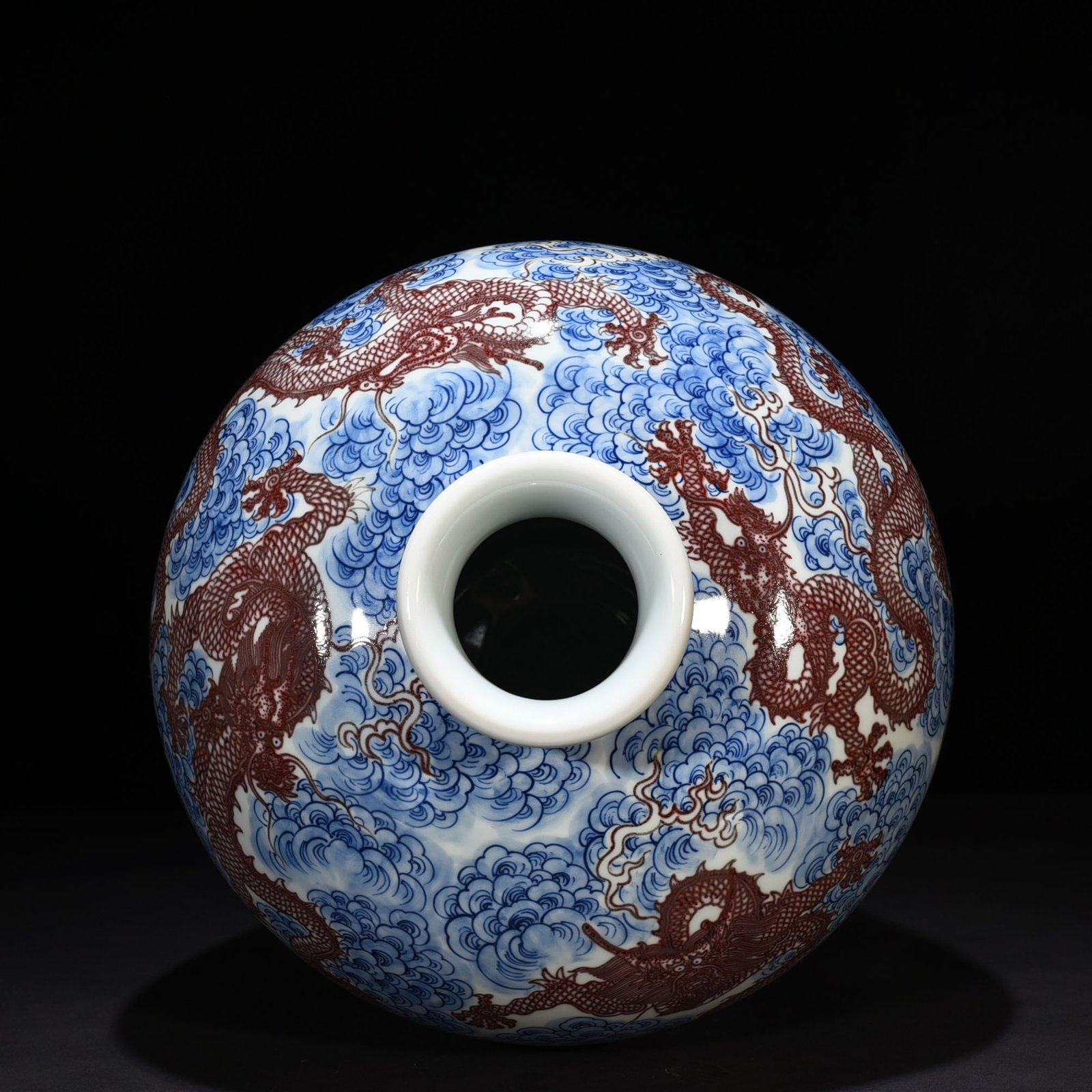 Qing Dynasty Qianlong blue and white underglaze red nine-dragon pattern plum vase