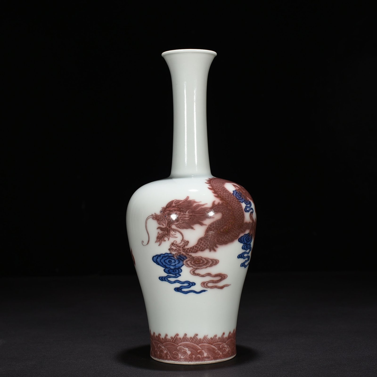 Qing Dynasty Qianlong blue and white underglaze red cloud and dragon pattern rattle vase