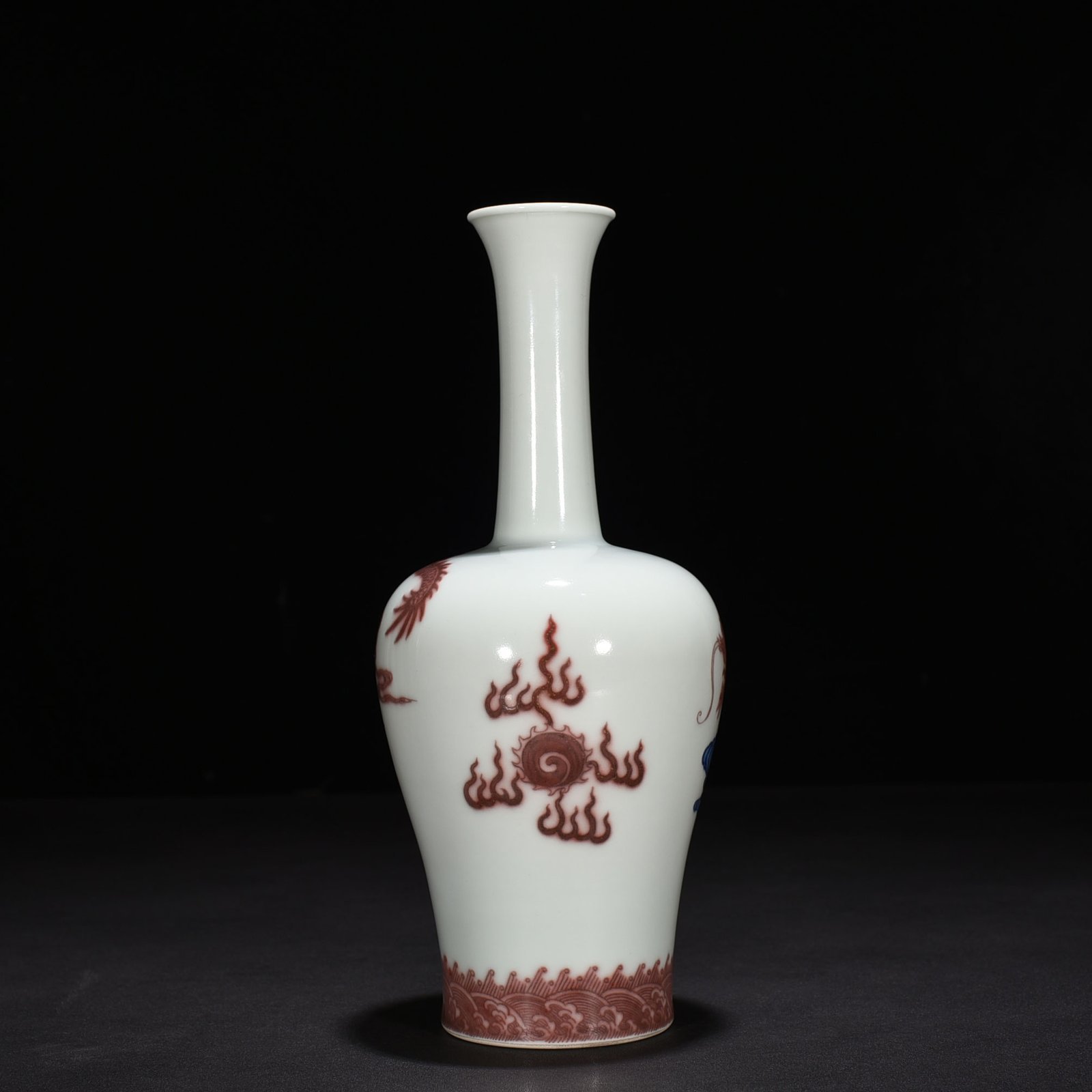 Qing Dynasty Qianlong blue and white underglaze red cloud and dragon pattern rattle vase