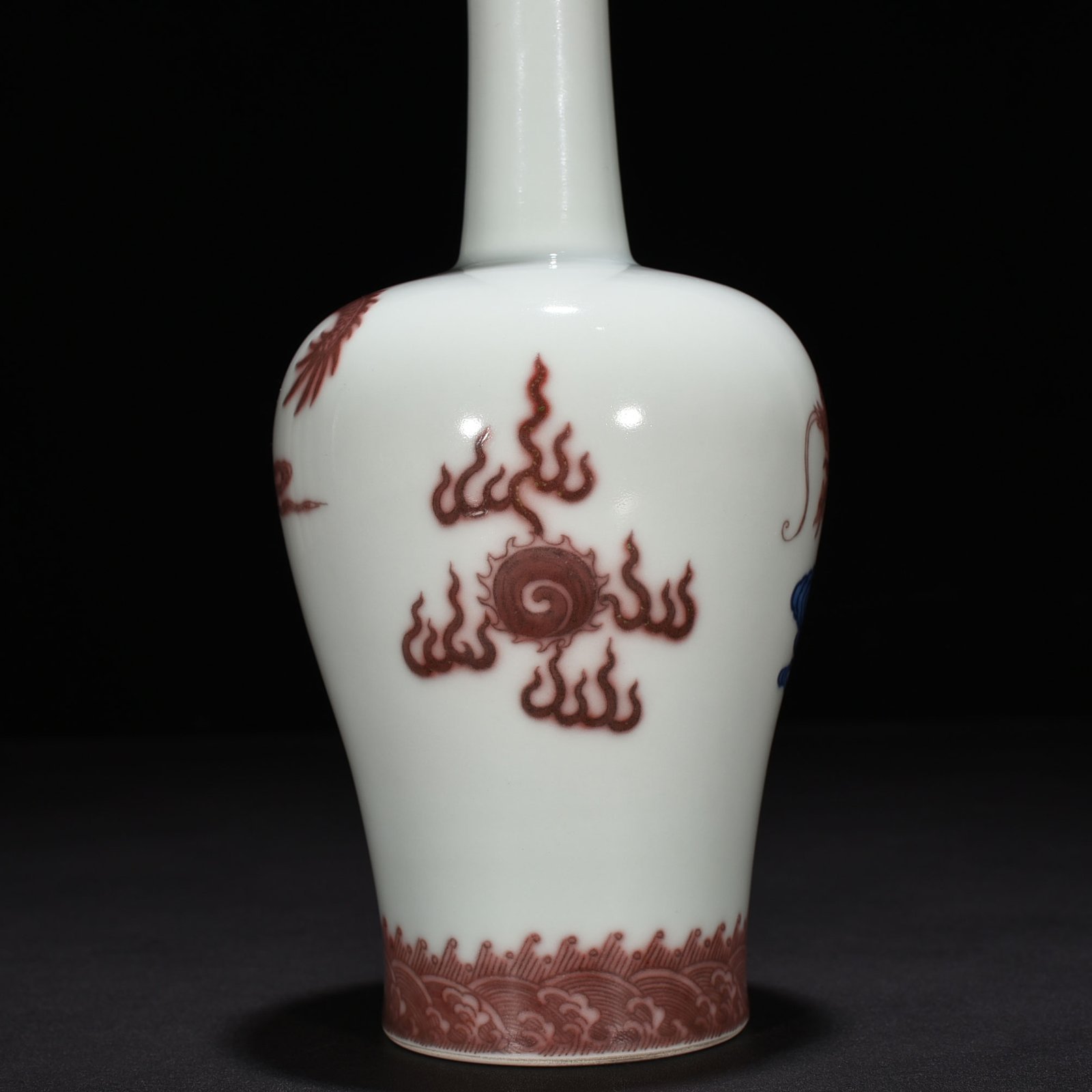 Qing Dynasty Qianlong blue and white underglaze red cloud and dragon pattern rattle vase