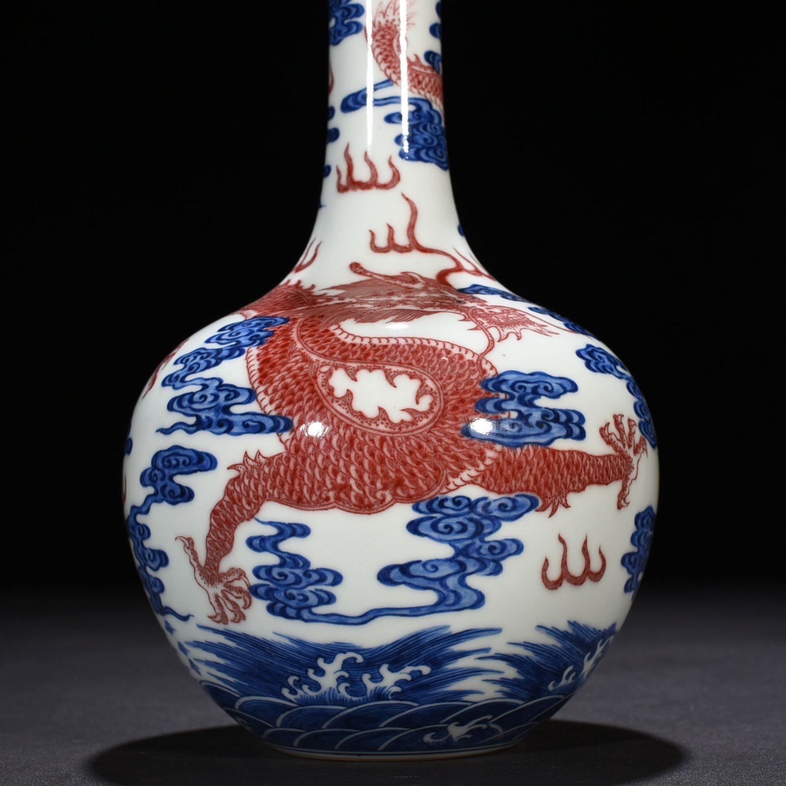 Qing Dynasty Qianlong blue and white underglaze red sea dragon pattern celestial sphere vase