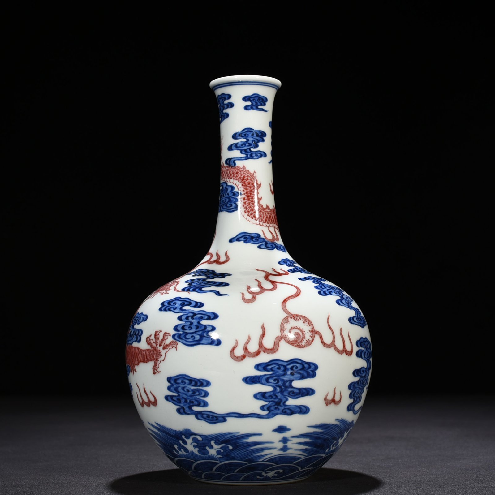 Qing Dynasty Qianlong blue and white underglaze red sea dragon pattern celestial sphere vase
