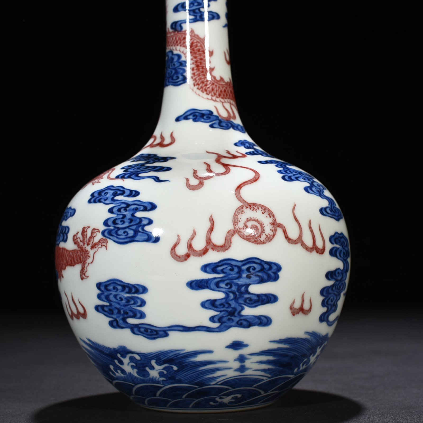 Qing Dynasty Qianlong blue and white underglaze red sea dragon pattern celestial sphere vase
