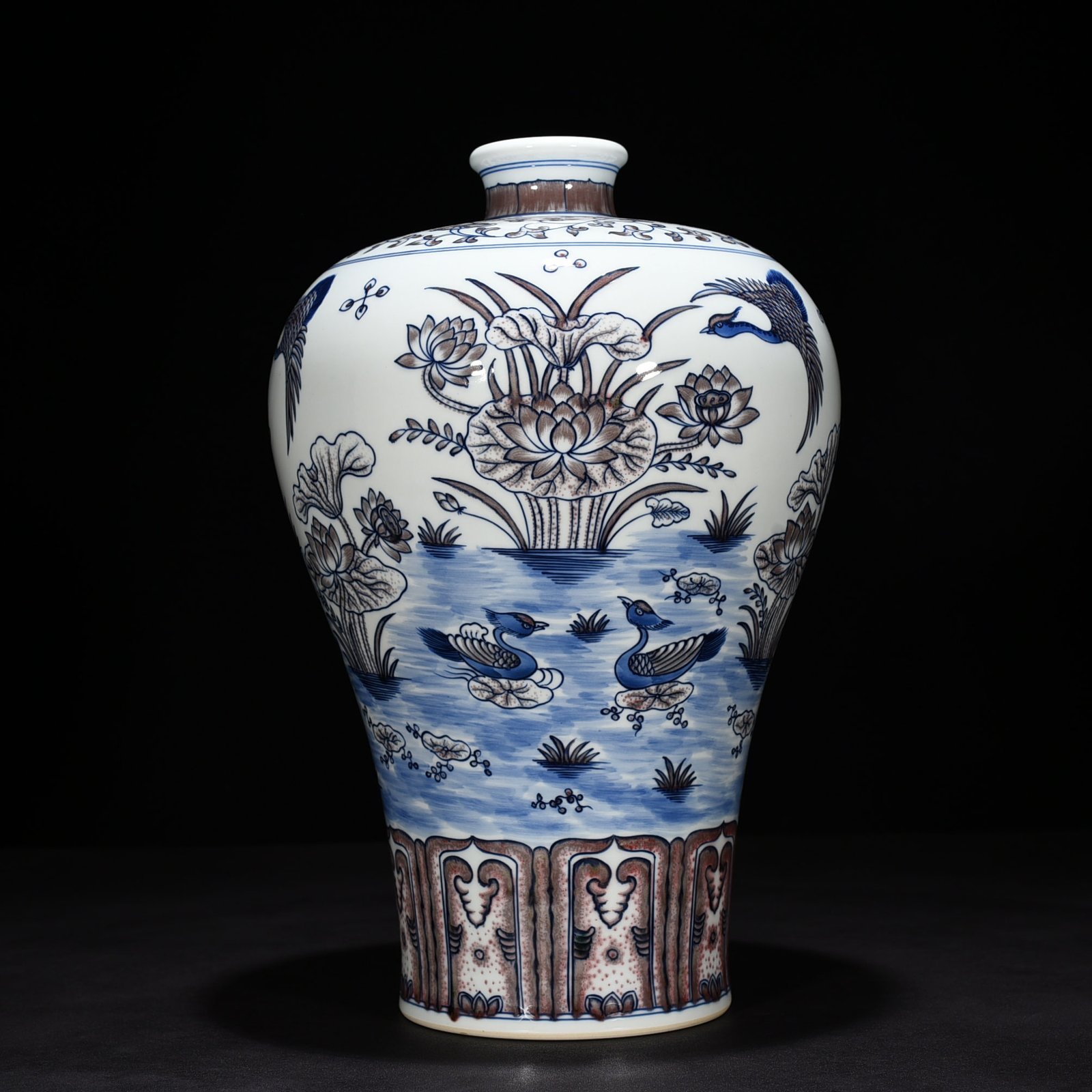 Qing Dynasty Qianlong blue and white underglaze red lotus pond plum vase
