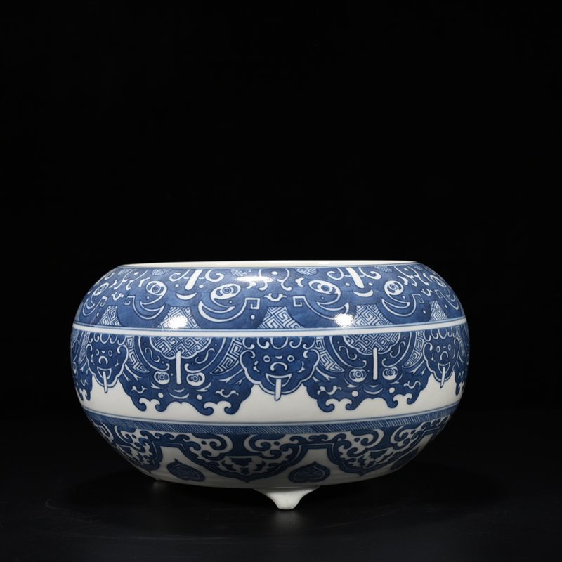 Qing Dynasty Qianlong blue and white Taotie animal mask pattern three-legged wash
