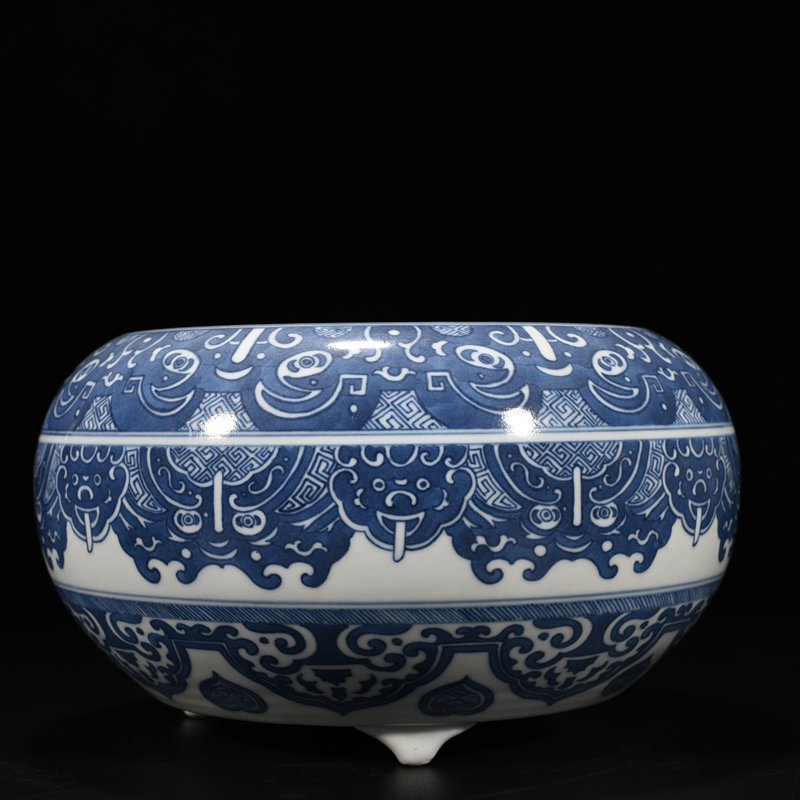 Qing Dynasty Qianlong blue and white Taotie animal mask pattern three-legged wash