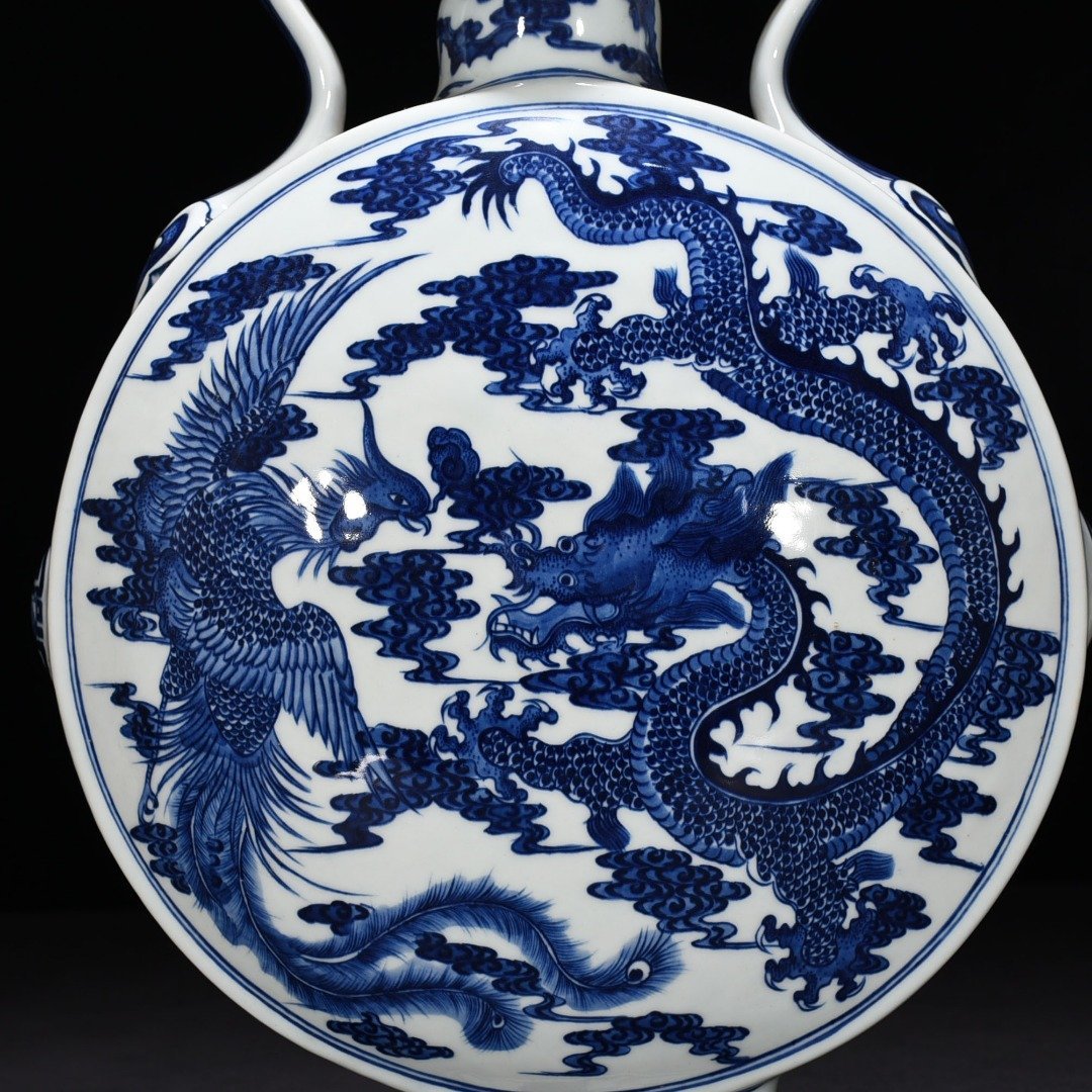 Qing Dynasty Qianlong blue and white dragon and phoenix pattern moon vase