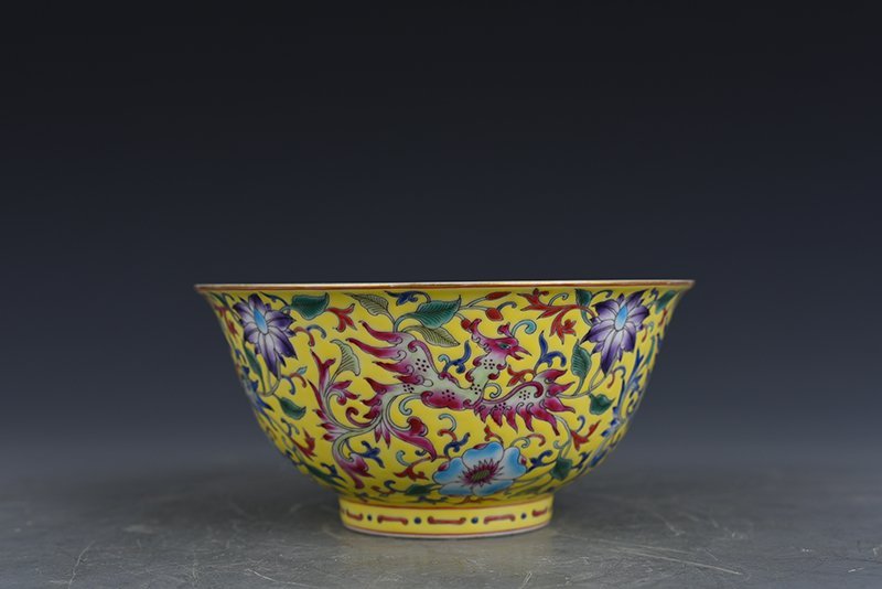 Qing Dynasty Qianlong yellow ground enamel phoenix flower pattern bowl