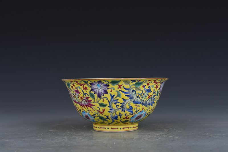 Qing Dynasty Qianlong yellow ground enamel phoenix flower pattern bowl