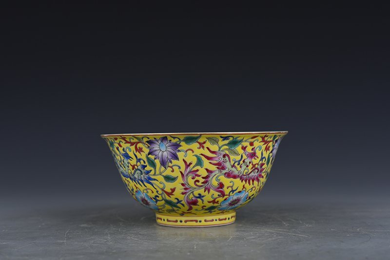 Qing Dynasty Qianlong yellow ground enamel phoenix flower pattern bowl