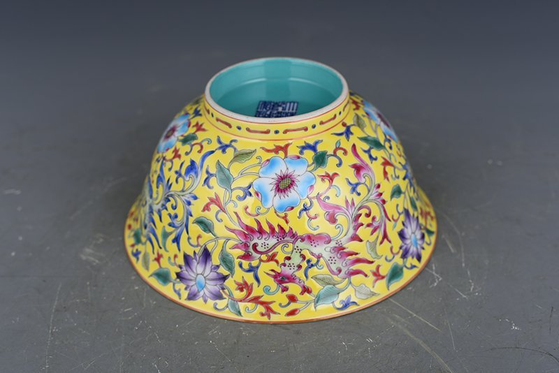 Qing Dynasty Qianlong yellow ground enamel phoenix flower pattern bowl