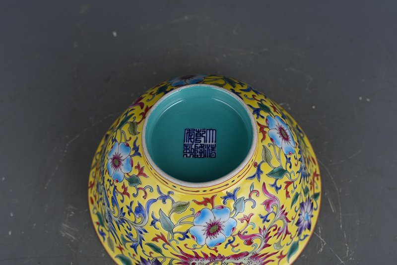 Qing Dynasty Qianlong yellow ground enamel phoenix flower pattern bowl