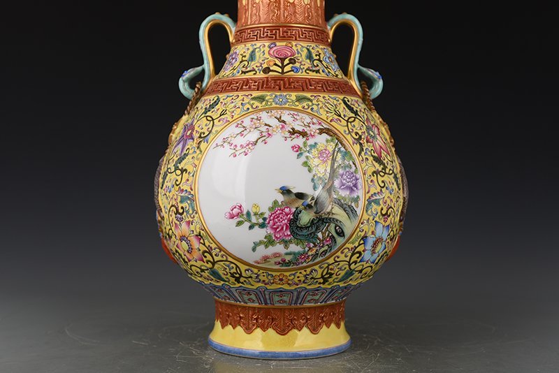 Qing Dynasty Qianlong yellow ground enamel consecrated flower and bird Ruyi ear vase