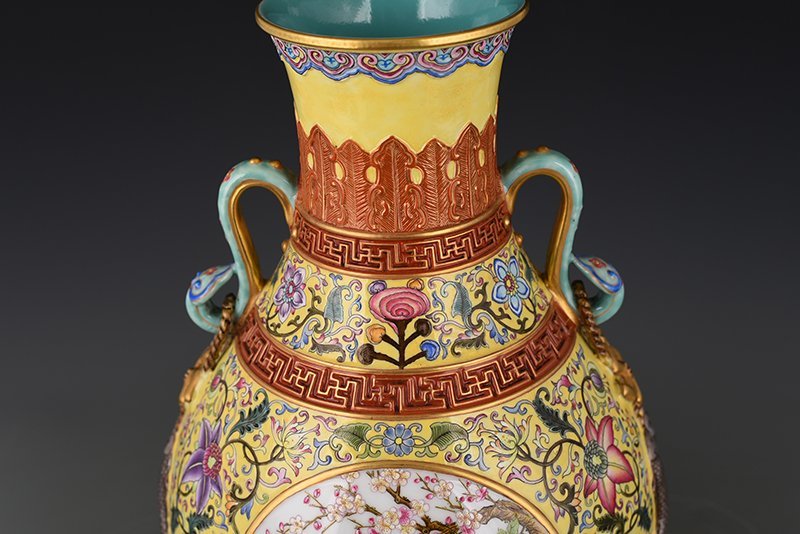 Qing Dynasty Qianlong yellow ground enamel consecrated flower and bird Ruyi ear vase