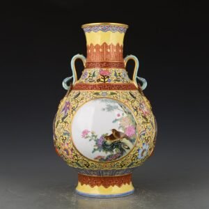 Qing Dynasty Qianlong yellow ground enamel consecrated flower and bird Ruyi ear vase