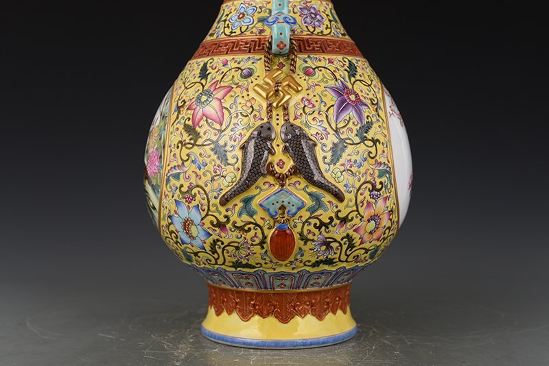 Qing Dynasty Qianlong yellow ground enamel consecrated flower and bird Ruyi ear vase