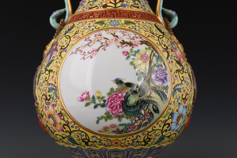 Qing Dynasty Qianlong yellow ground enamel consecrated flower and bird Ruyi ear vase