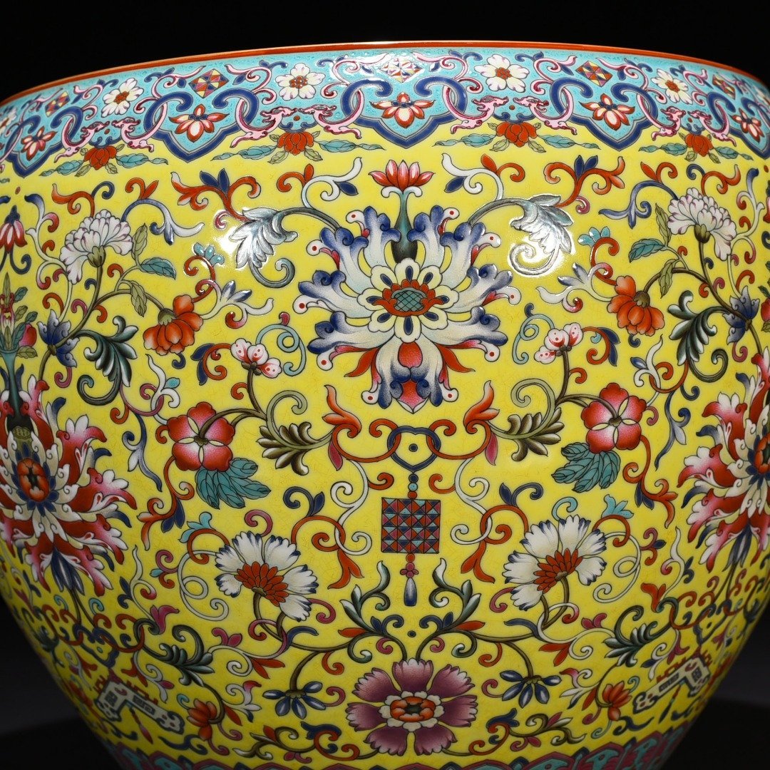 Qing Dynasty Qianlong yellow ground enamel scroll vat with entwining branches and floral patterns