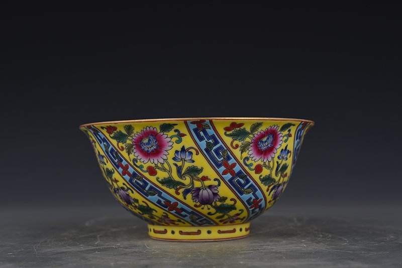 Qing Dynasty Qianlong yellow ground enamel flower pattern bowl