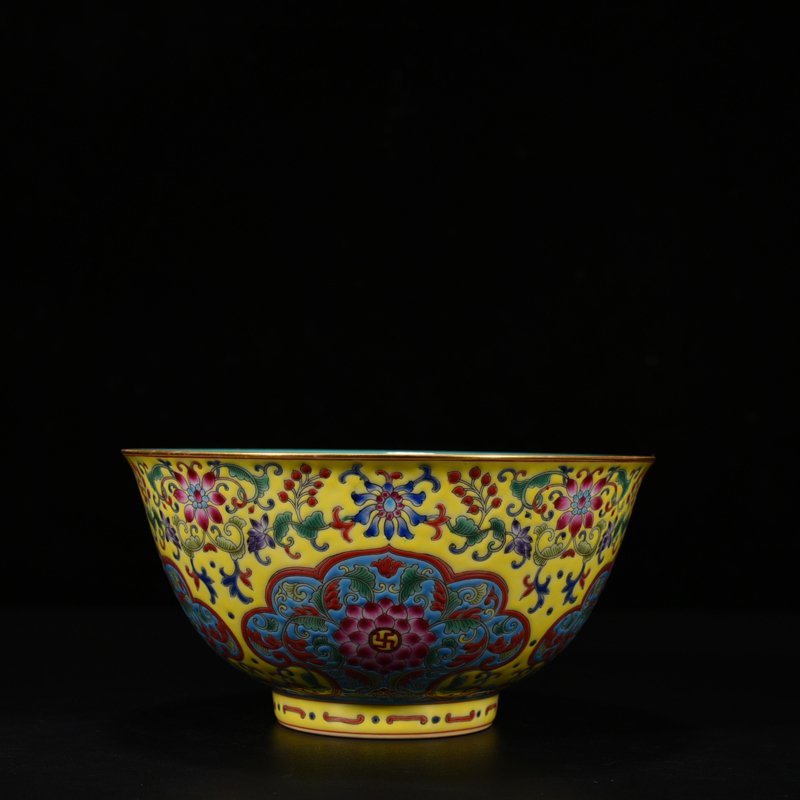 Qing Dynasty Qianlong yellow ground pastel consecrated bowl with floral pattern