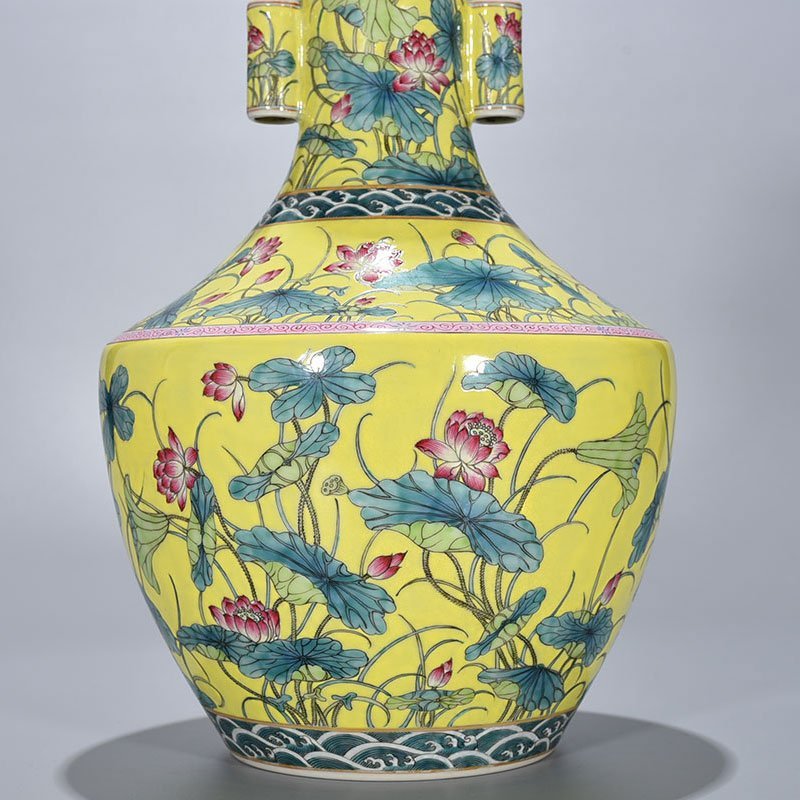 Qing Dynasty Qianlong yellow ground pastel lotus pattern through-ear vase