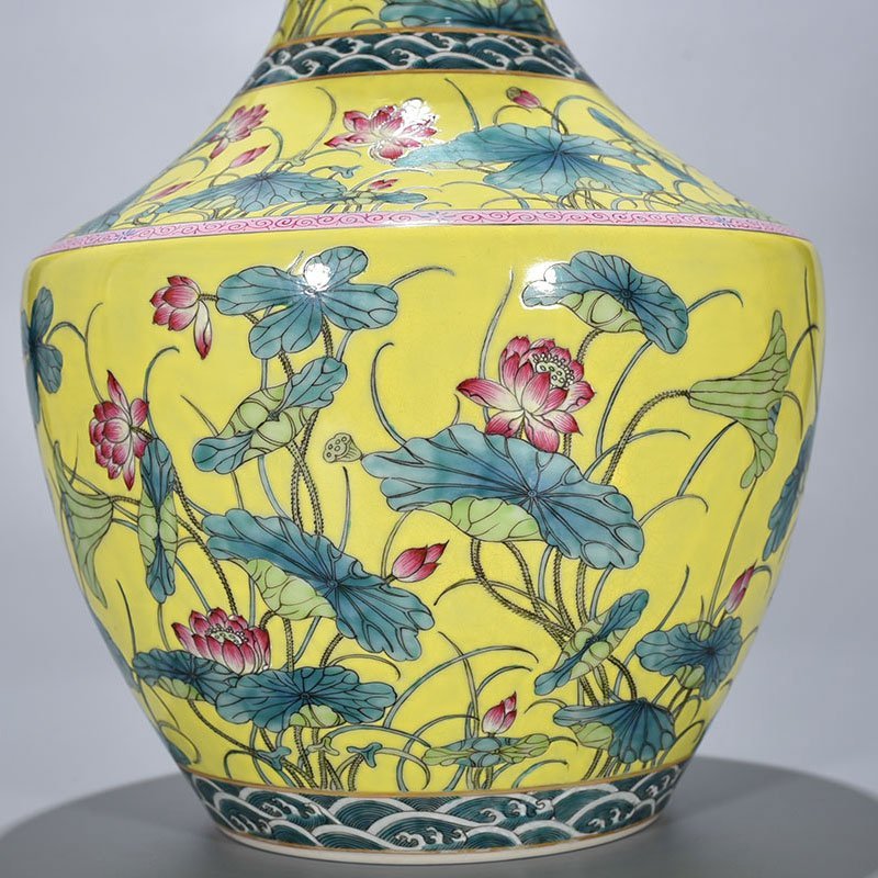 Qing Dynasty Qianlong yellow ground pastel lotus pattern through-ear vase