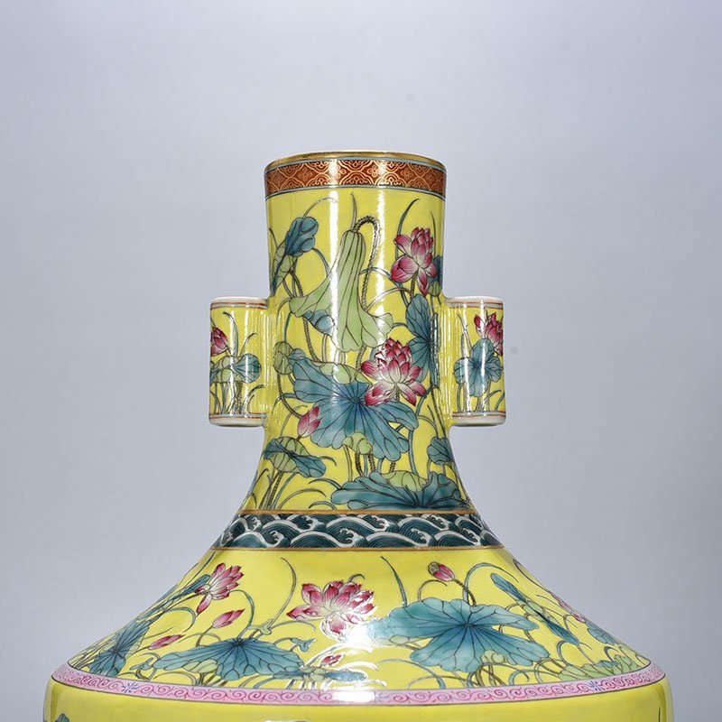 Qing Dynasty Qianlong yellow ground pastel lotus pattern through-ear vase