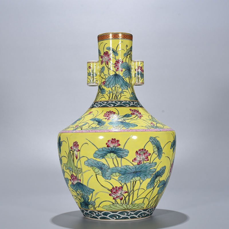 Qing Dynasty Qianlong yellow ground pastel lotus pattern through-ear vase