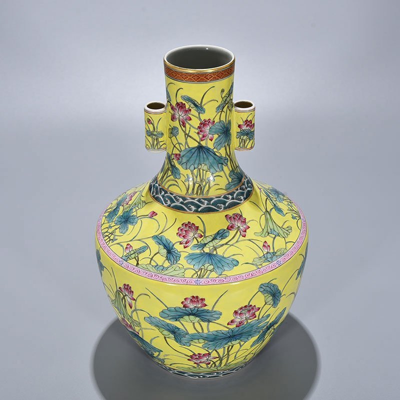 Qing Dynasty Qianlong yellow ground pastel lotus pattern through-ear vase