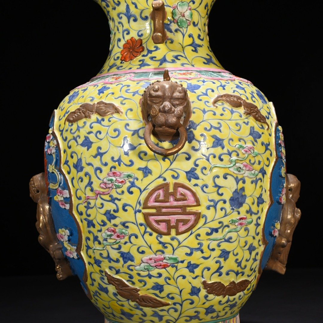 Qing Dynasty Qianlong yellow ground pastel carved Guanyin double-eared statue
