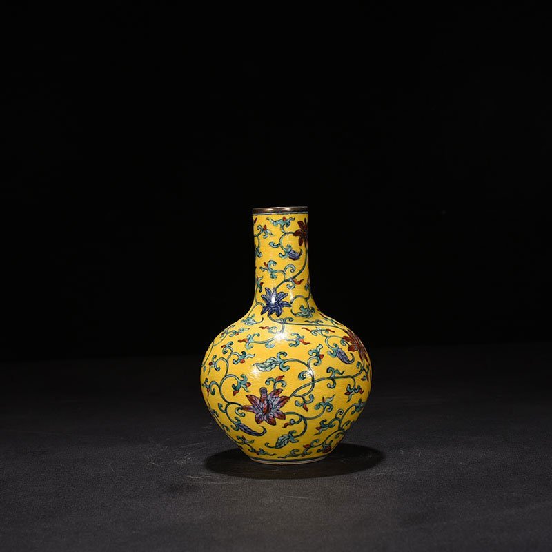 Qing Dynasty Qianlong yellow ground celestial vase with floral pattern