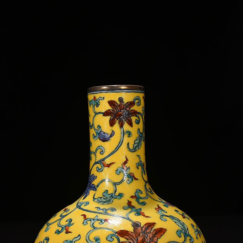 Qing Dynasty Qianlong yellow ground celestial vase with floral pattern