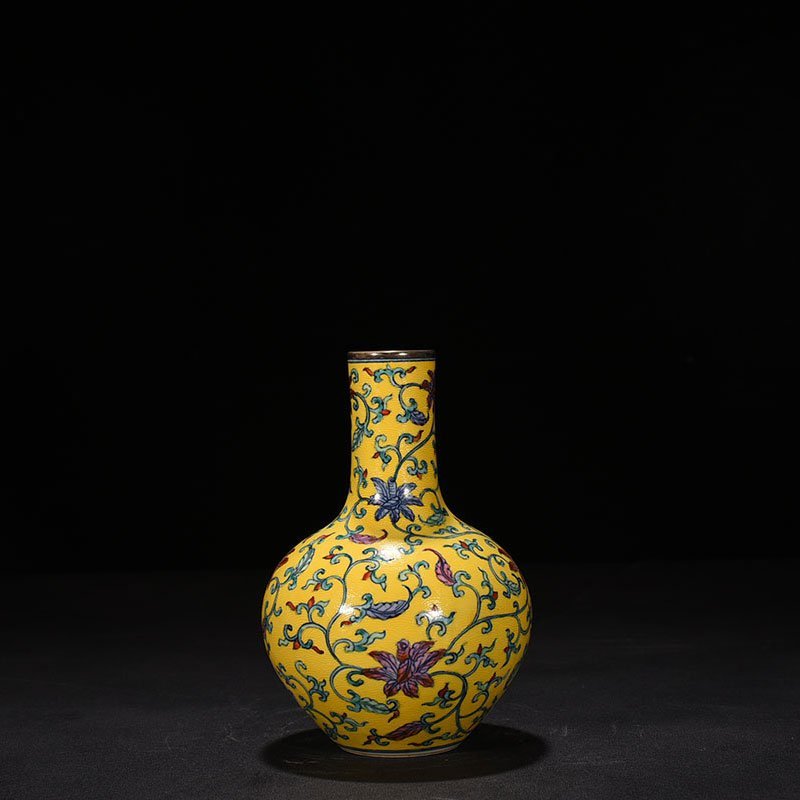 Qing Dynasty Qianlong yellow ground celestial vase with floral pattern