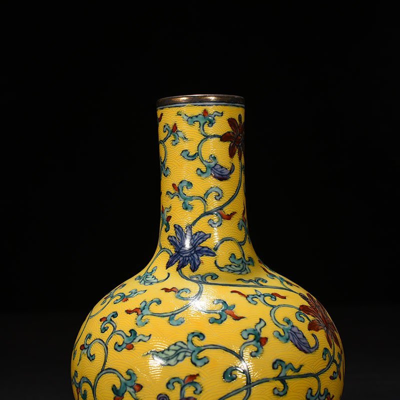 Qing Dynasty Qianlong yellow ground celestial vase with floral pattern