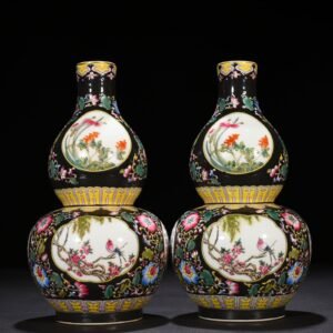 Qing Dynasty Qianlong black ground enamel gourd vase