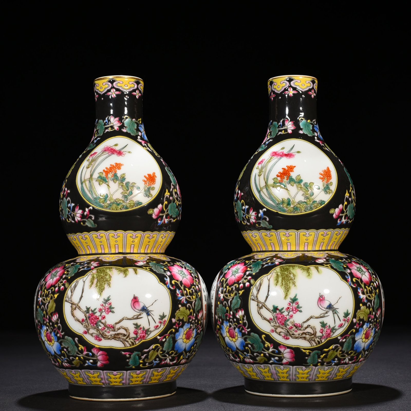 Qing Dynasty Qianlong black ground enamel gourd vase