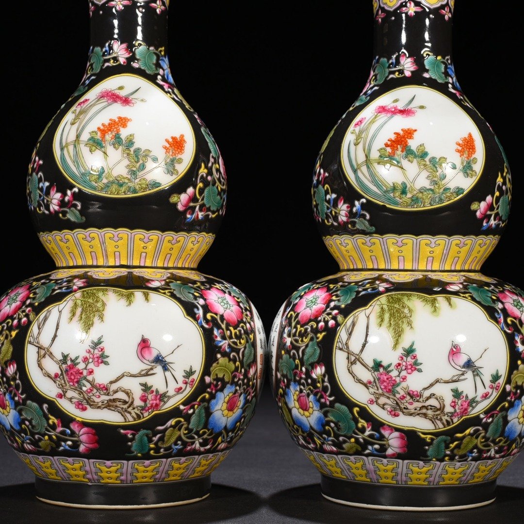 Qing Dynasty Qianlong black ground enamel gourd vase
