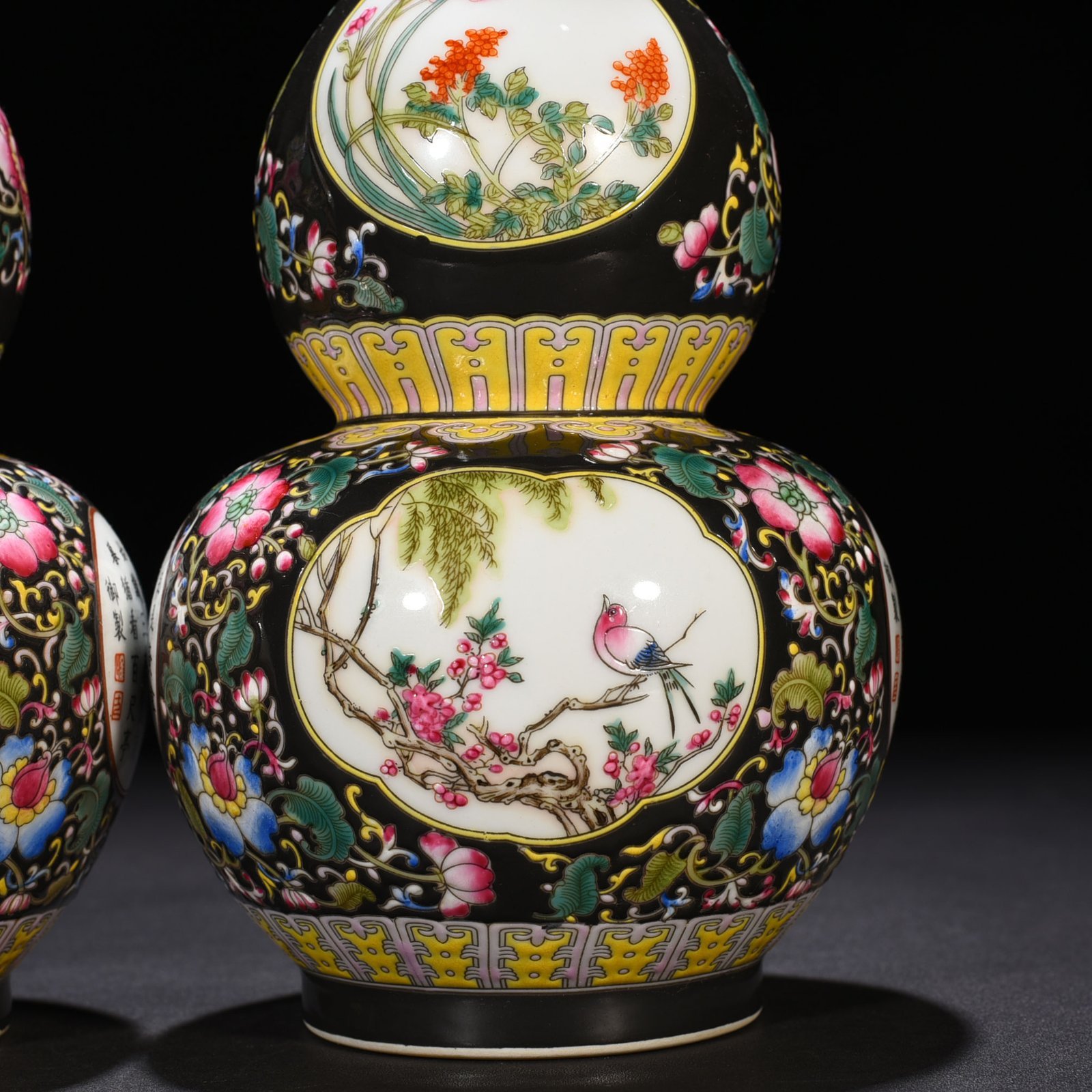 Qing Dynasty Qianlong black ground enamel gourd vase