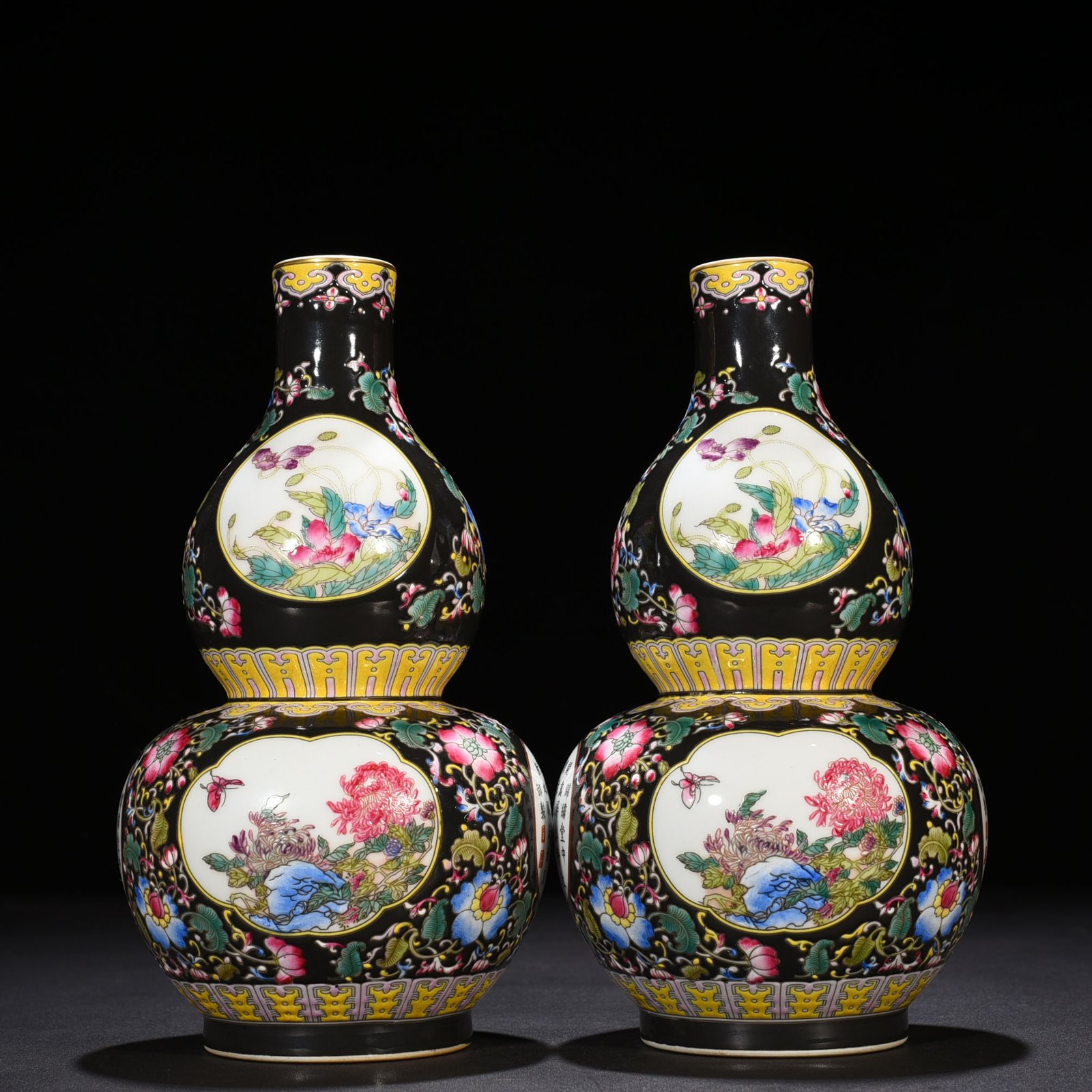 Qing Dynasty Qianlong black ground enamel gourd vase
