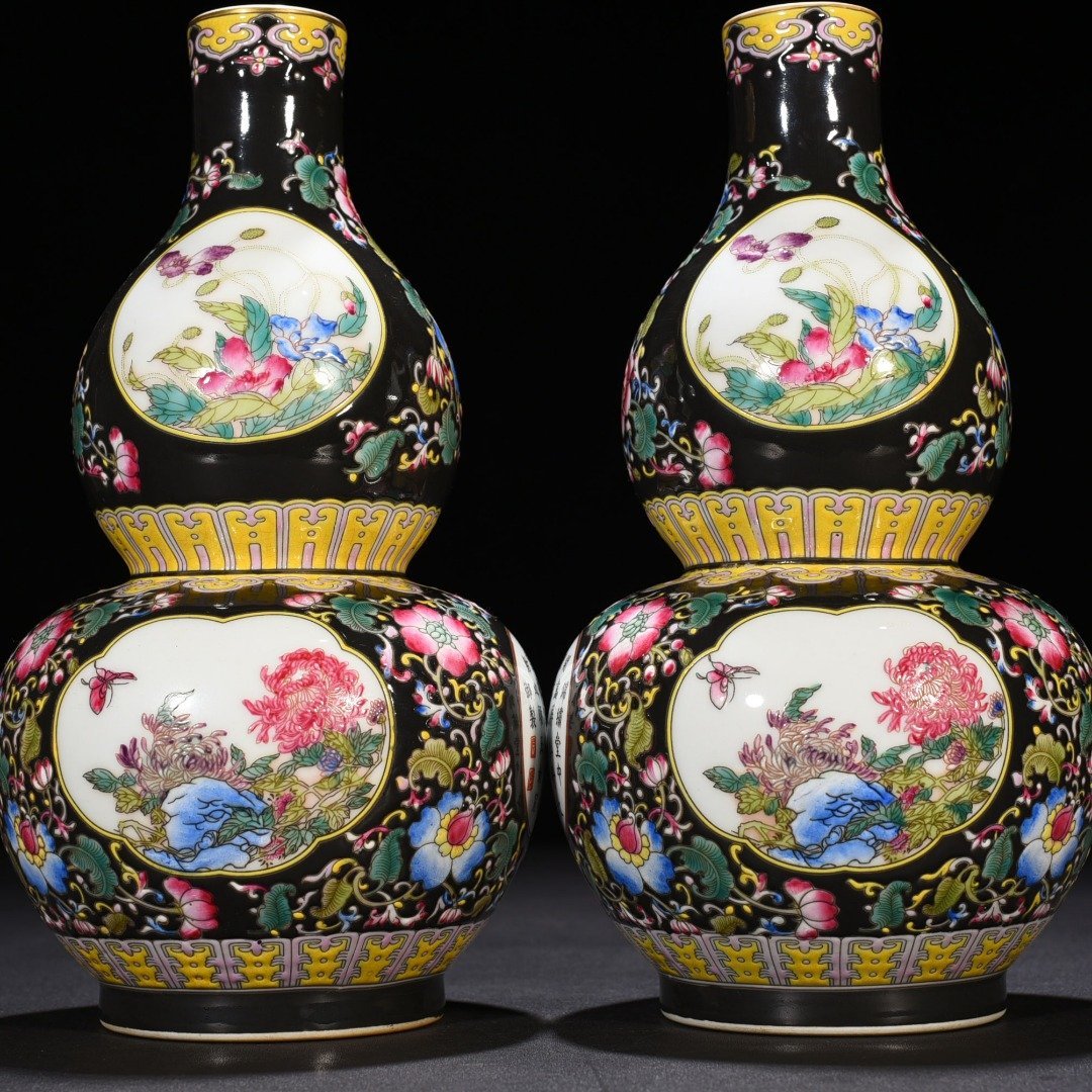 Qing Dynasty Qianlong black ground enamel gourd vase