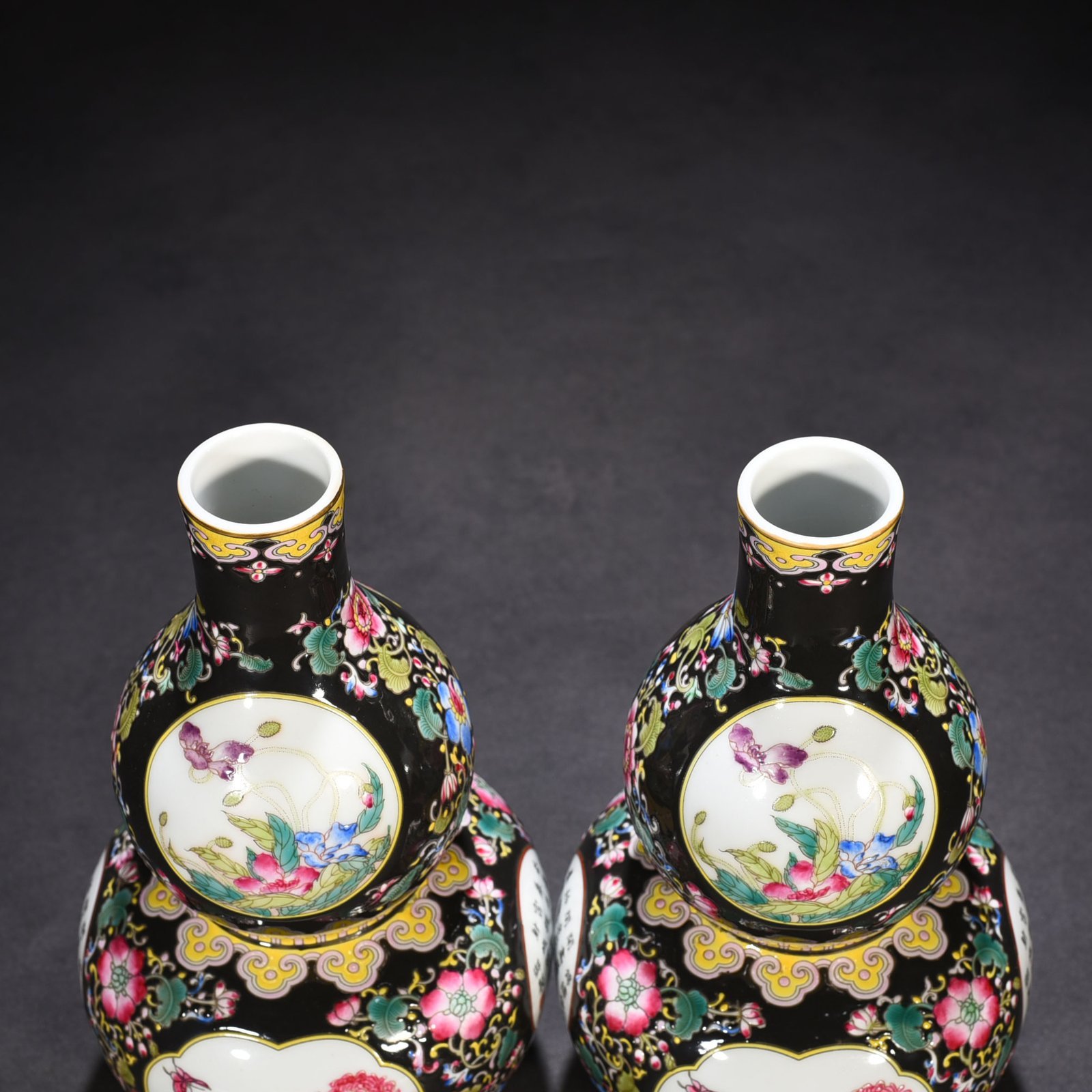 Qing Dynasty Qianlong black ground enamel gourd vase
