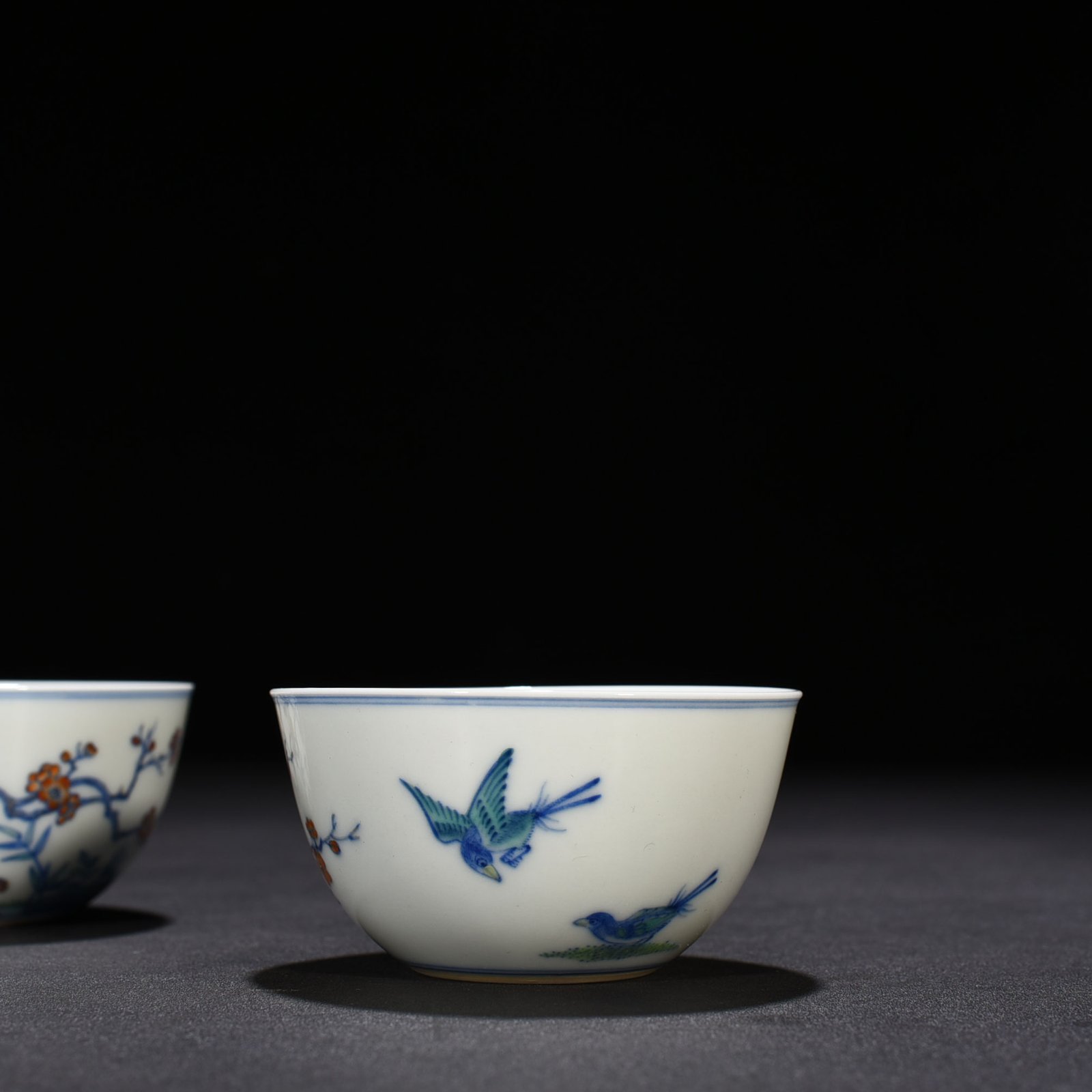 Qing Dynasty Yongzheng doucai magpie plum pattern lying foot cup