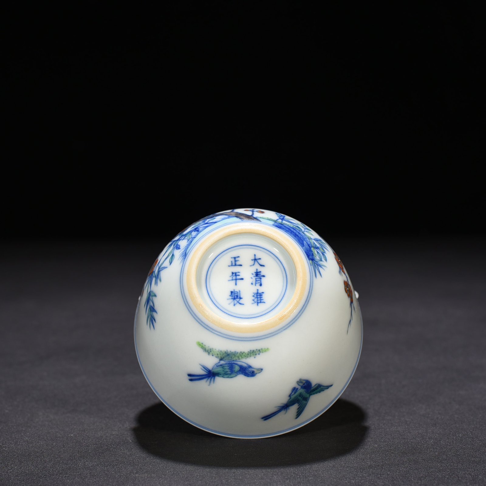 Qing Dynasty Yongzheng doucai magpie plum pattern lying foot cup