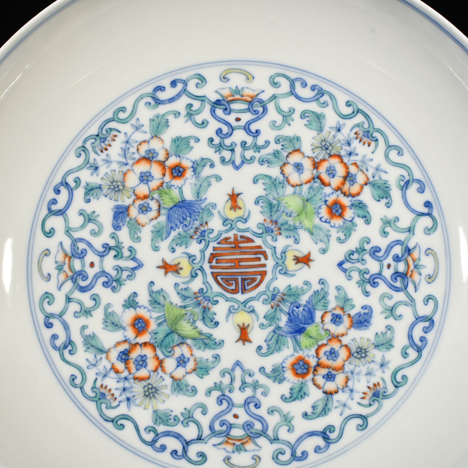 Qing Dynasty Yongzheng doucai blessing and longevity flower pattern plate