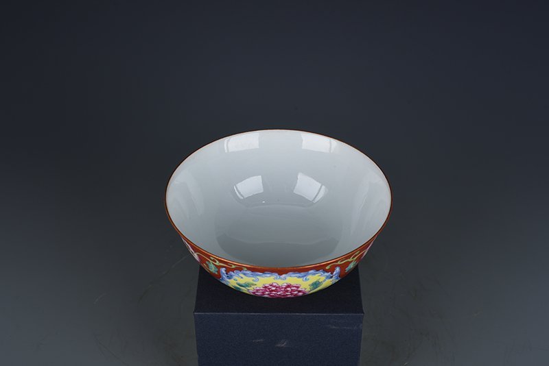 Qing Dynasty Yongzheng red ground consecrated enamel peony flower bowl