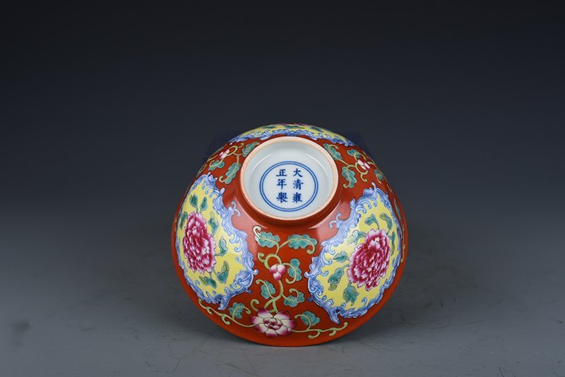 Qing Dynasty Yongzheng red ground consecrated enamel peony flower bowl