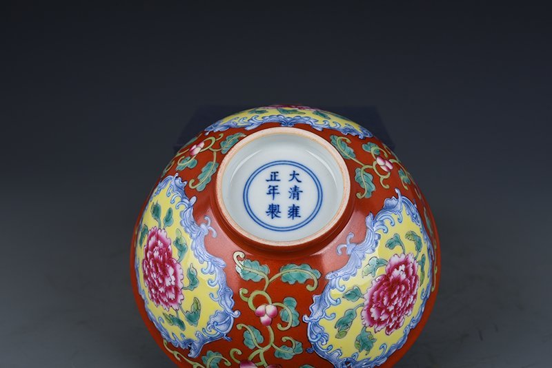 Qing Dynasty Yongzheng red ground consecrated enamel peony flower bowl